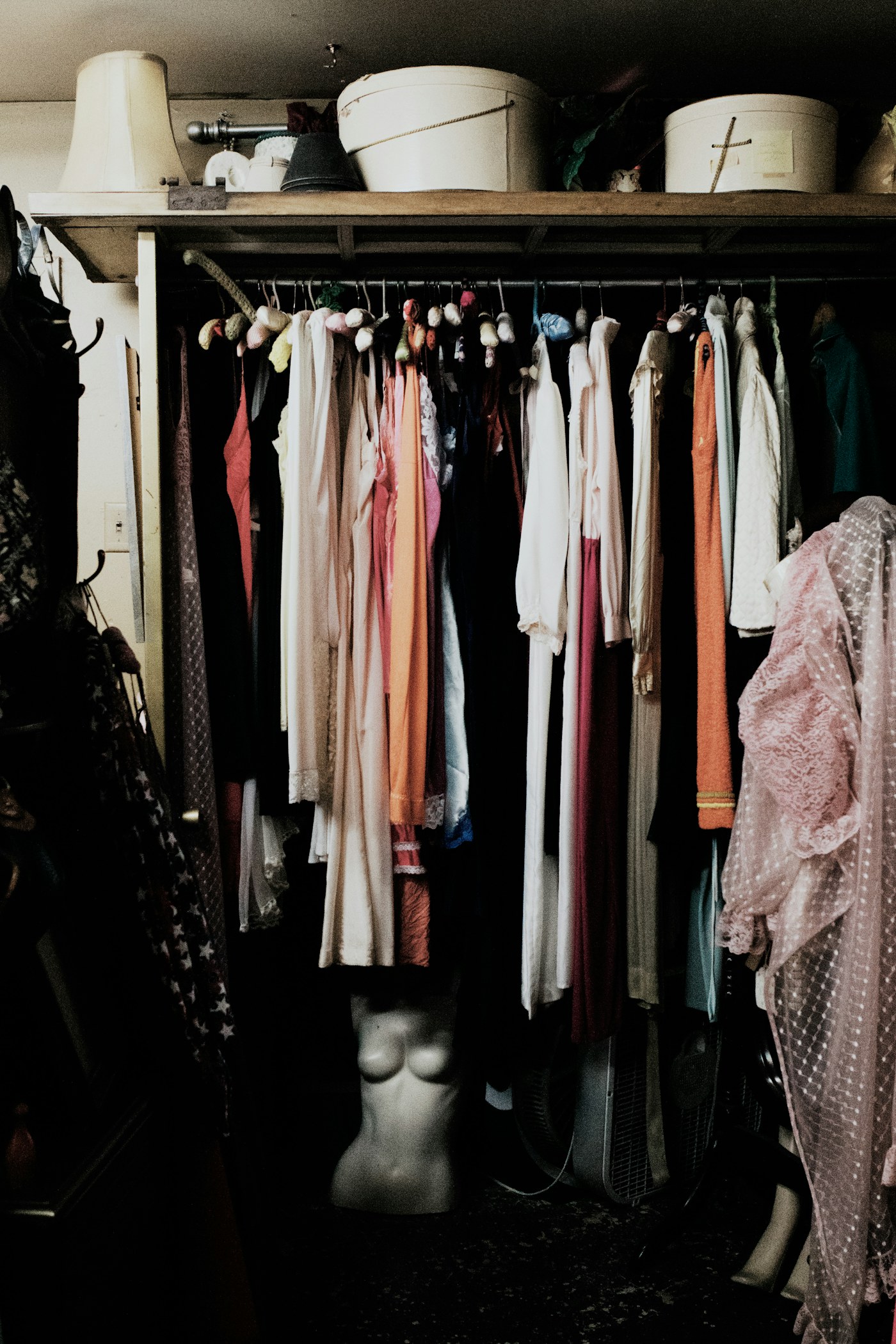 Clothing hanging on a wardrobe rail