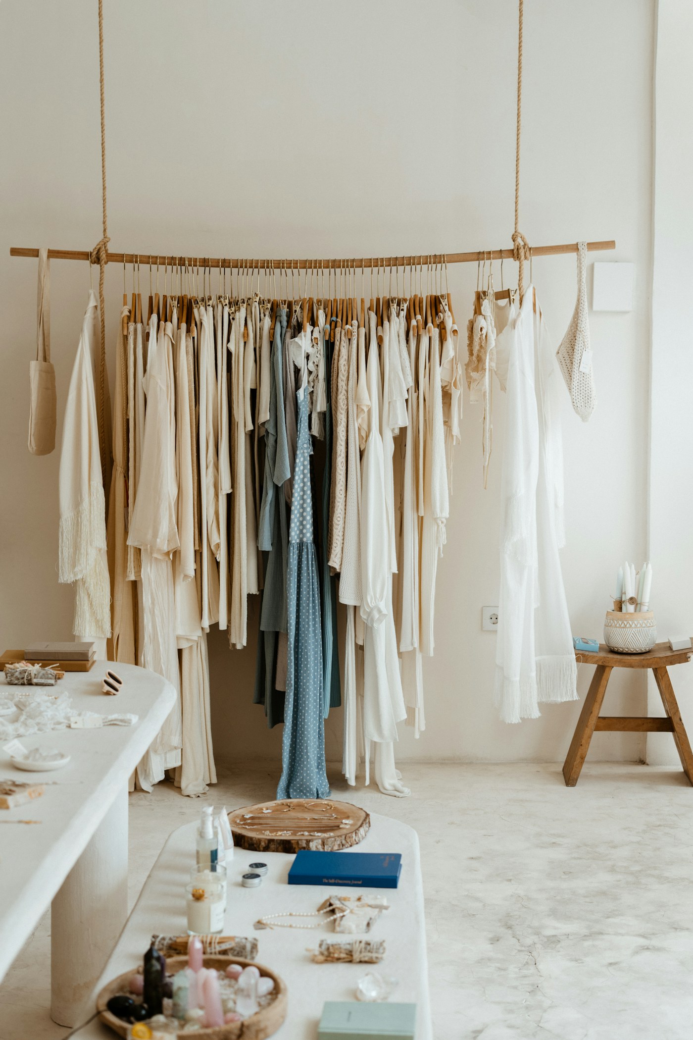 Clothes hanging in a walk-in wardrobe