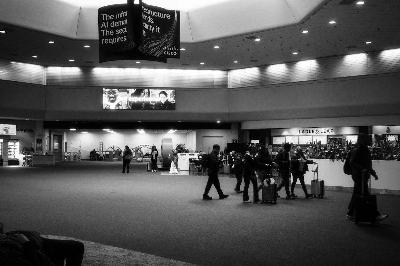 Travelers with luggage in an airport terminal