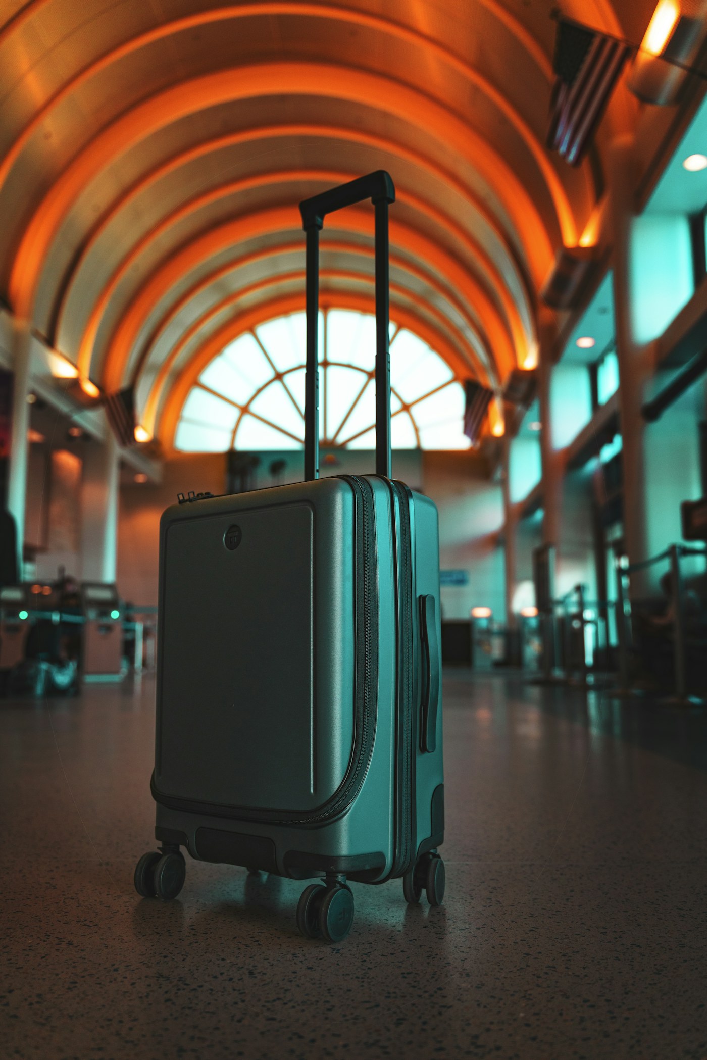 A suitcase standing in an airport